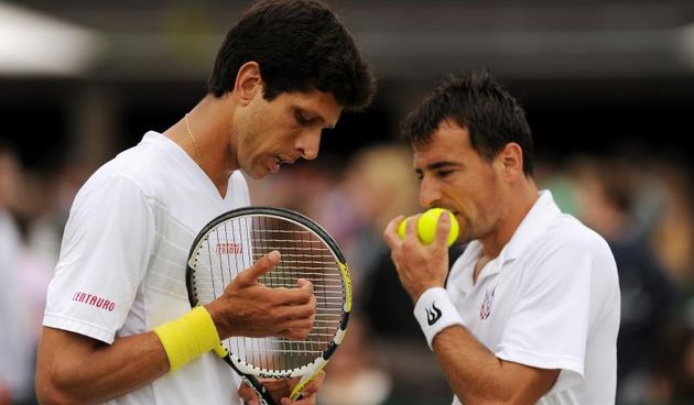 Tennis – 2013 Wimbledon Championships – Day Five – The All England Lawn Tennis and Croquet ClubCroatia’s Ivan Dodig and Brazil’s Marcelo Melo (left) in their doubles match against Poland’s Mateusz Kowalczyr (left) and Tomasz BednarekEMPICS Sport Photo: Pr