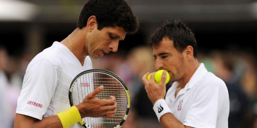 Tennis – 2013 Wimbledon Championships – Day Five – The All England Lawn Tennis and Croquet ClubCroatia’s Ivan Dodig and Brazil’s Marcelo Melo (left) in their doubles match against Poland’s Mateusz Kowalczyr (left) and Tomasz BednarekEMPICS Sport Photo: Pr Tennis – 2013 Wimbledon Championships – Day Five – The All England Lawn Tennis and Croquet ClubCroatia’s Ivan Dodig and Brazil’s Marcelo Melo (left) in their doubles match against Poland’s Mateusz Kowalczyr (left) and Tomasz BednarekEMPICS Sport Photo: Pr