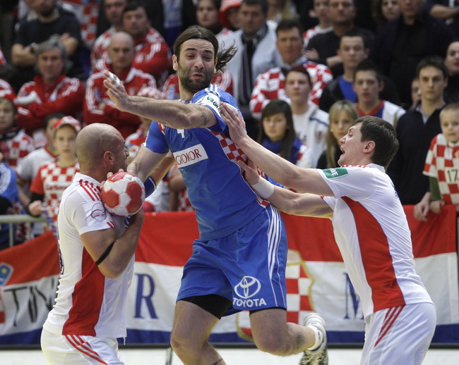 Graz, 210110.
EURO 2010 u rukometu. 
Trece kolo skupine A. Utakmica Hrvatska – Rusija.
Na fotografiji: Konstantin Igropulo, Ivano Balic, Dmitry Kovalev.
Foto: Nenad Dugi / Cropix