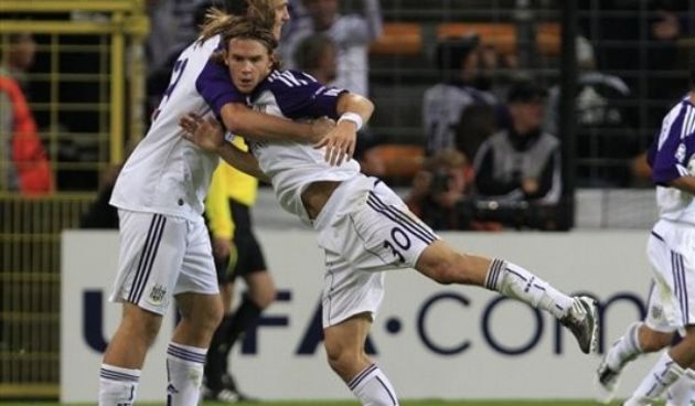 RSC Anderlecht player Guillaume Gillet gets congratulated by a team mate / AP Photo