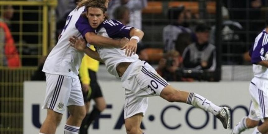 RSC Anderlecht player Guillaume Gillet gets congratulated by a team mate / AP Photo RSC Anderlecht player Guillaume Gillet gets congratulated by a team mate / AP Photo